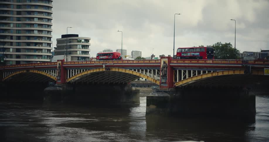 London buses passing over Vauxhall Bridge over the River Thames