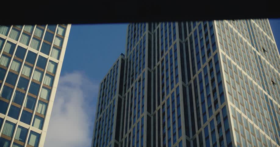 View of tall London skyscrapers from the ground on a sunny day