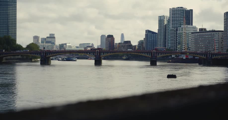 Traffic moving along Vauxhall Bridge over London's River Thames