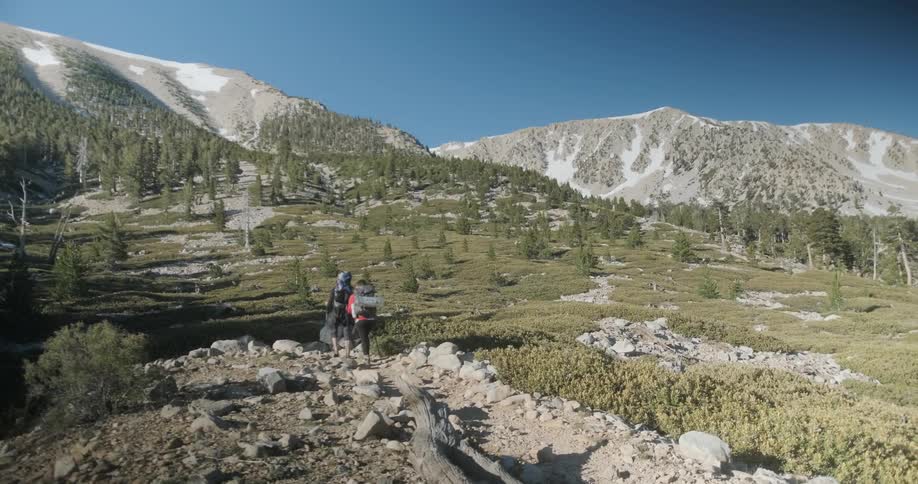 Hikers trek towards the mountain