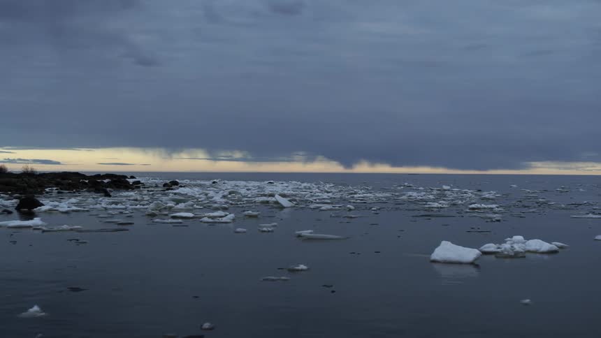 Ice formations are scattered in the water