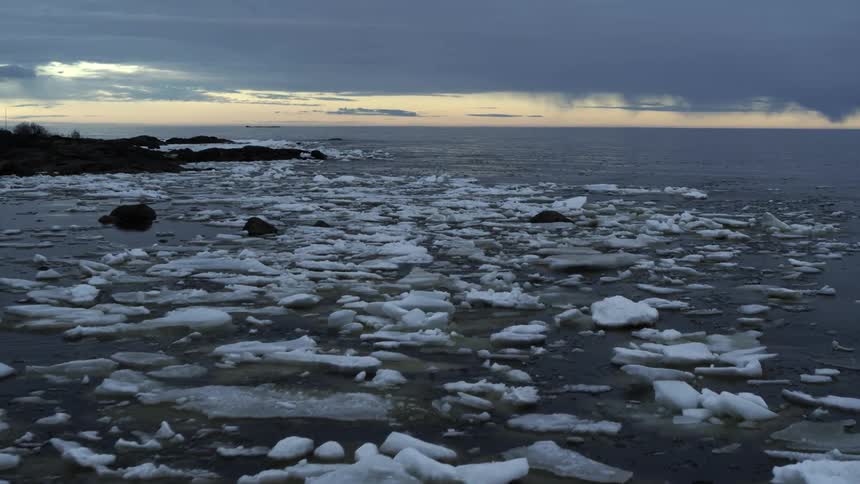 Ice formations are scattered in the water
