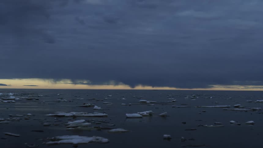 Ice formations are scattered in the water