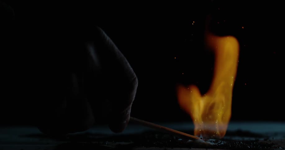 A match lights the flame