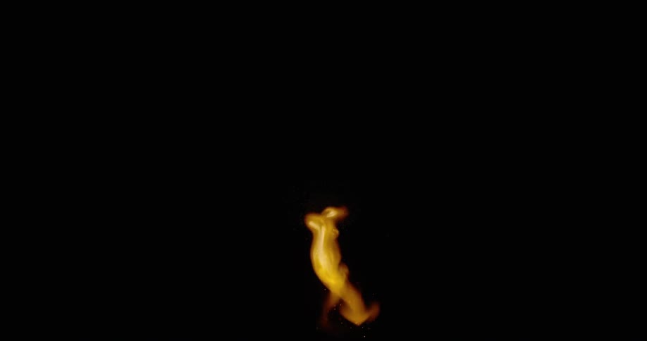 A match burns in pitch black