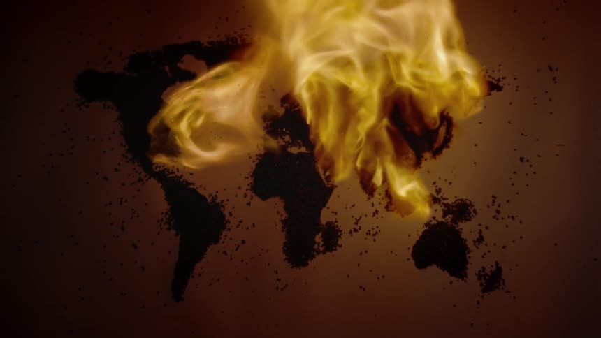 Fire burns graphic representation of continents on earth