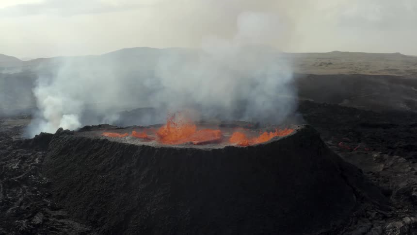 Volcano erupting with boiling lava and smoke billowing in an astounding spectacle of nature