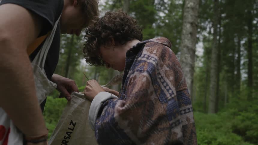 A man and woman check in their bag