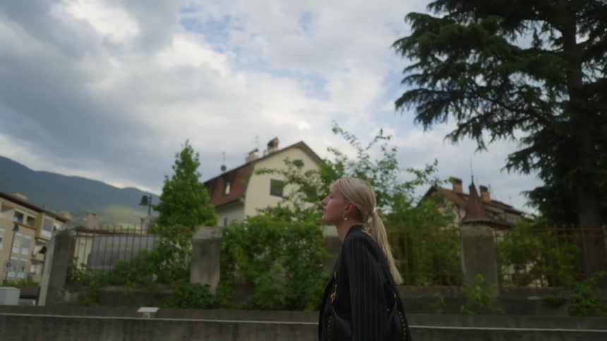 A woman is walking through town