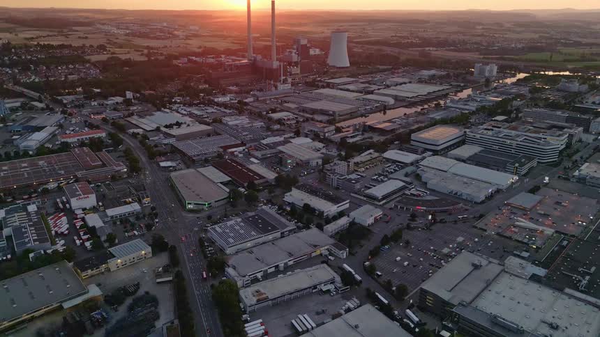 Factories and warehouses surrounding a nuclear power plant