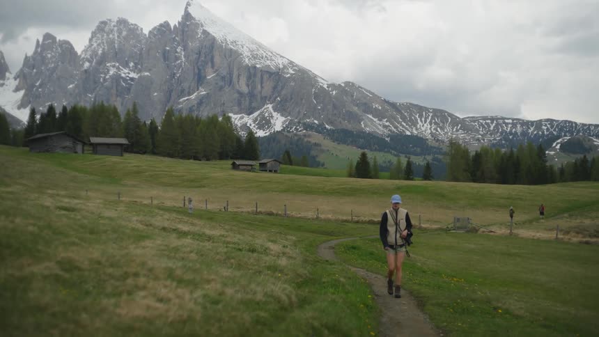 A woman is hiking on the trail