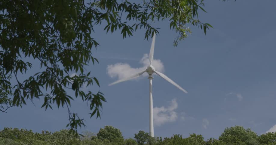 Wind turbine platform in motion in an open space within nature