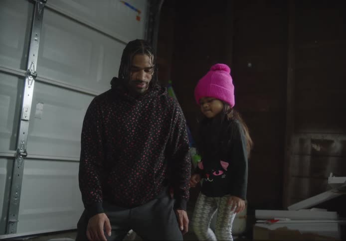Father passing the soccer ball to his daughter who kicked it toward her mother and sister