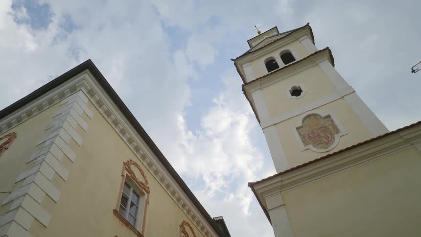 Steeple and corner of building on cloudy day