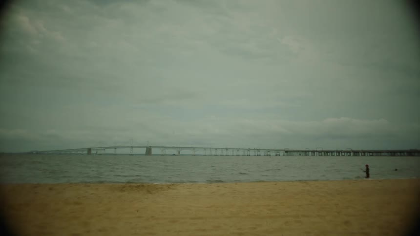 Gentle waves crashed on the seashore during the sunny day