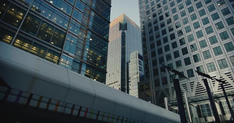 Tall buildings and skyscrapers stand close together on downtown streets