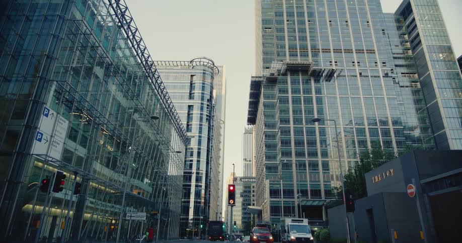 Street in a metropolitan city during day time with skyscrappers and traffic