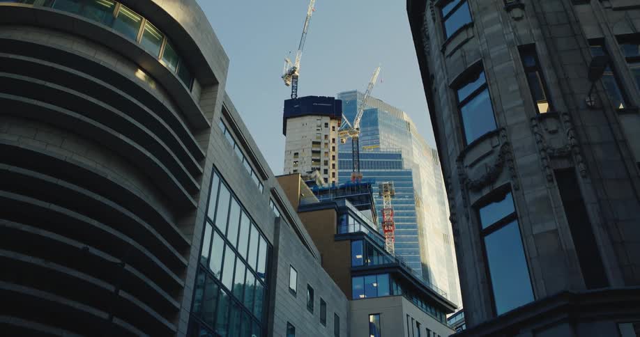 View of a metropolis with towering skyscrapers and external architecture in mirrored glass