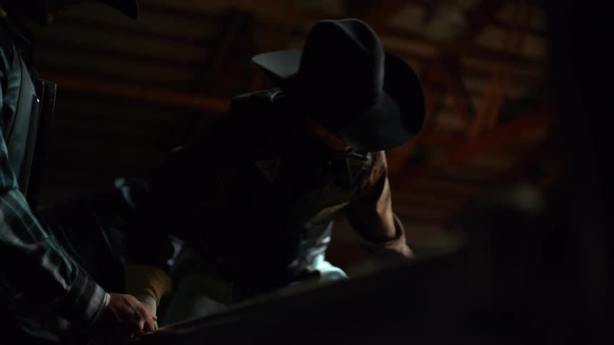 Bull rider preparing to take a ride