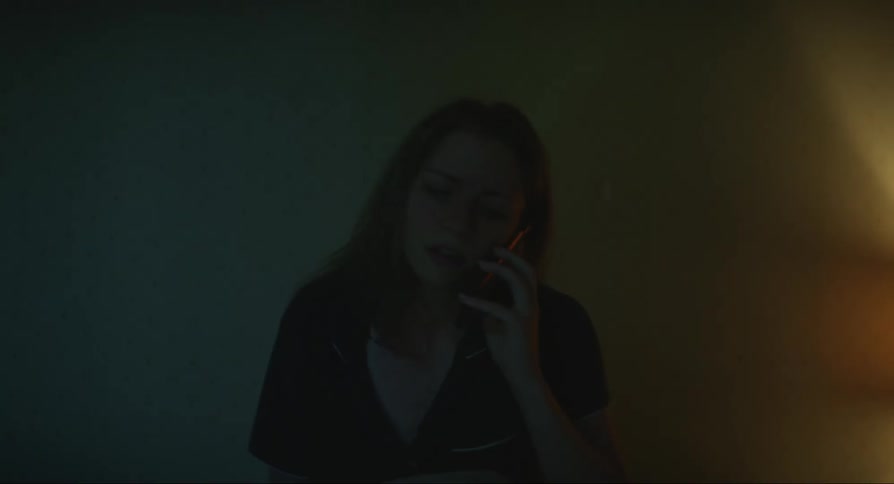 Woman woken up by phone call sits up in bed to have upsetting conversation