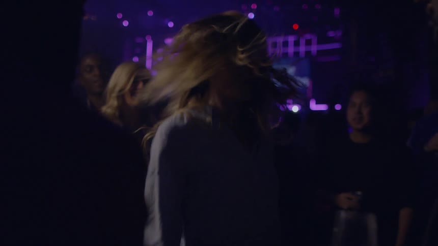 Group of people dancing in a club