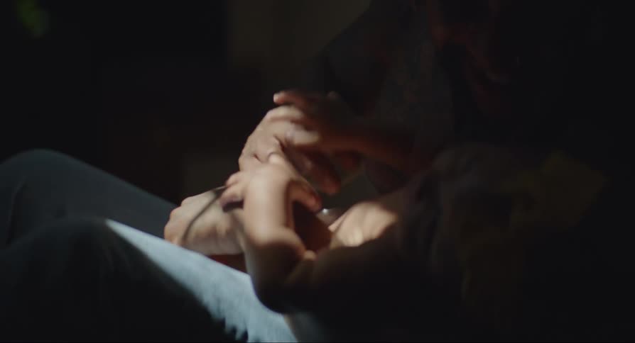 Father and daughter play with tickling at home