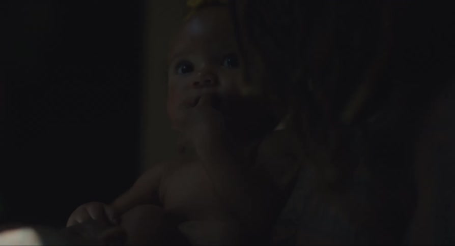 Mother holding her baby daughter in her arms