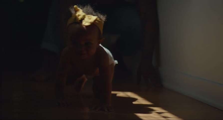 Baby walking on the floor with her hands