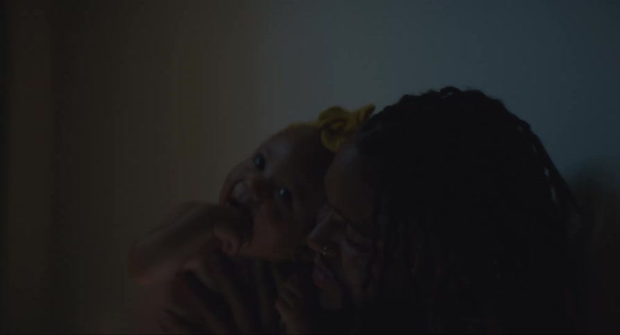 Father playfully interacting with his baby daughter in an affectionate manner