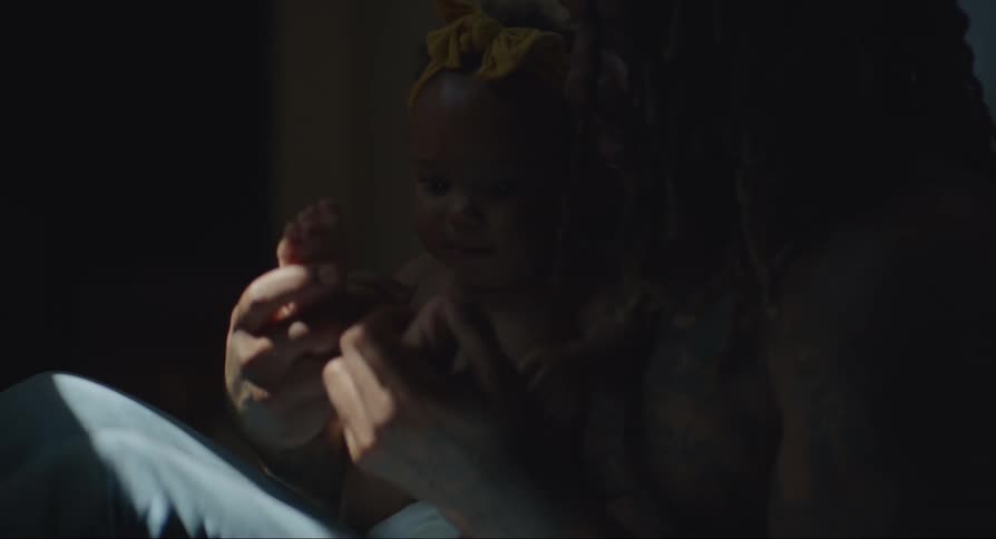 Father playing with his baby daughter