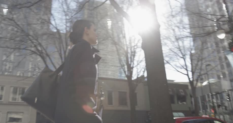 Woman walking down a city street