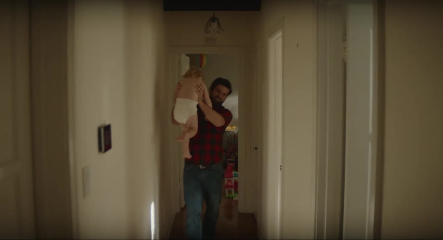 Man carried his baby from one room into another