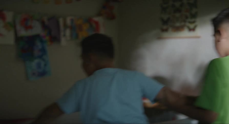 Woman separating children who were fighting among themselves