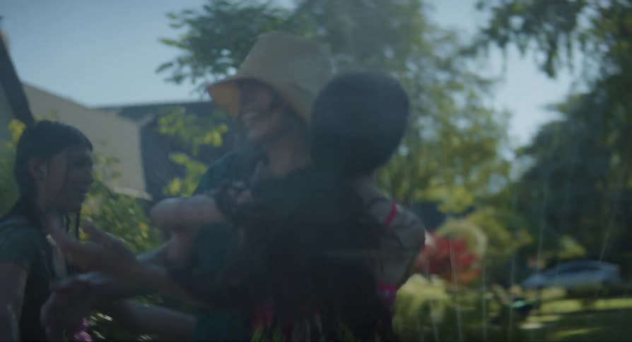 Mother hugging her daughters who are wet