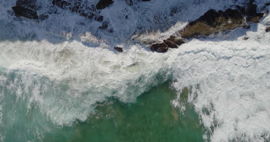 Sea waves crashing into a rocky coast