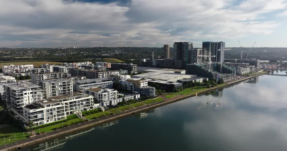 Aerial view of residential area and tall buildings near the river in the city