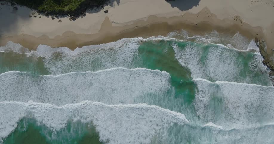 Sea waves rolling towards a beach