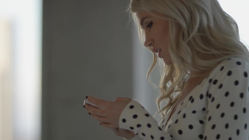 A woman is using her phone