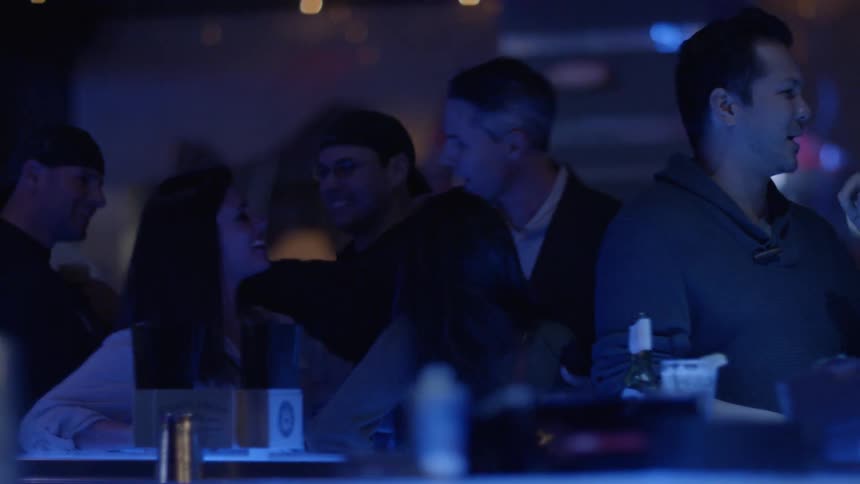 People socialize in a nightclub