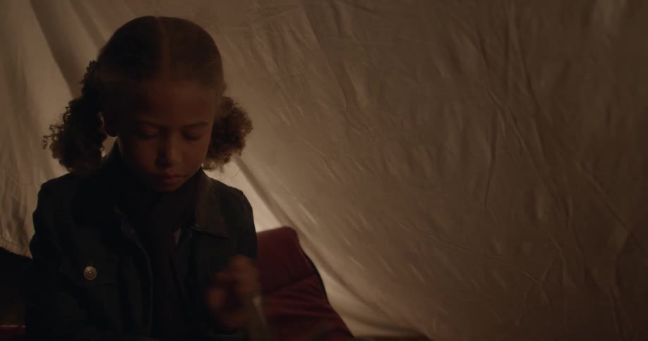Young girl turning pages of a book