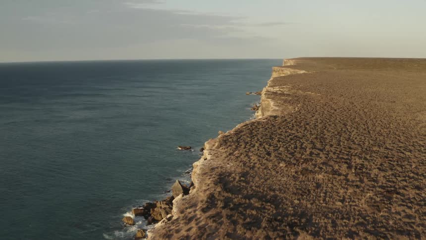 Aerial view of a cliff on a coastal area during day time