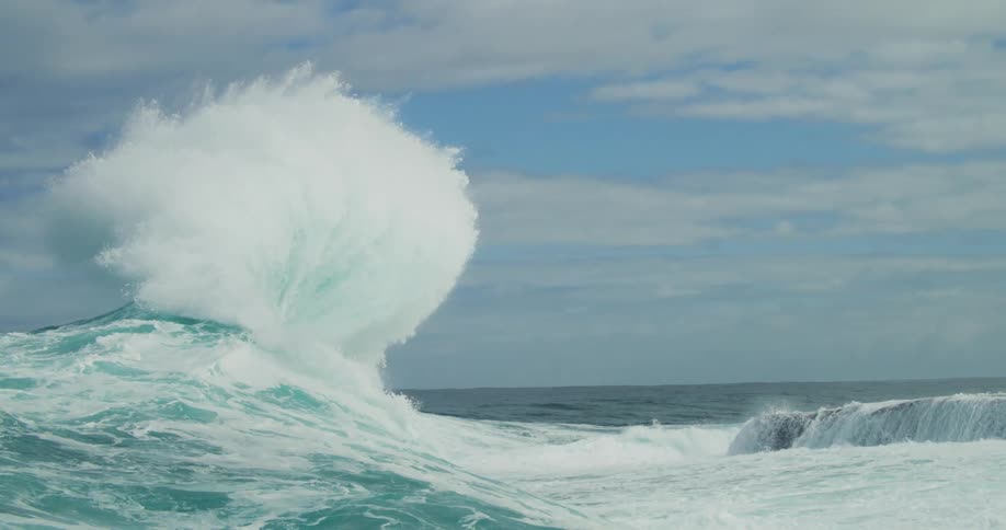 Waves crashing at the sea with no land in sight outdoors during day time