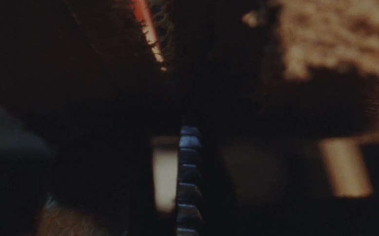Closeup of a machine cutting through wood