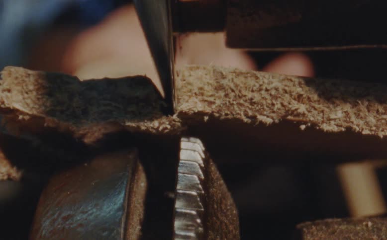 Machine cutting a leather sole in the manufacturing process