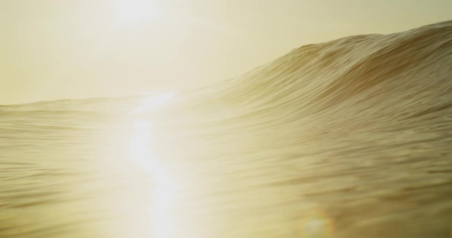 A wave slowly rolls forward