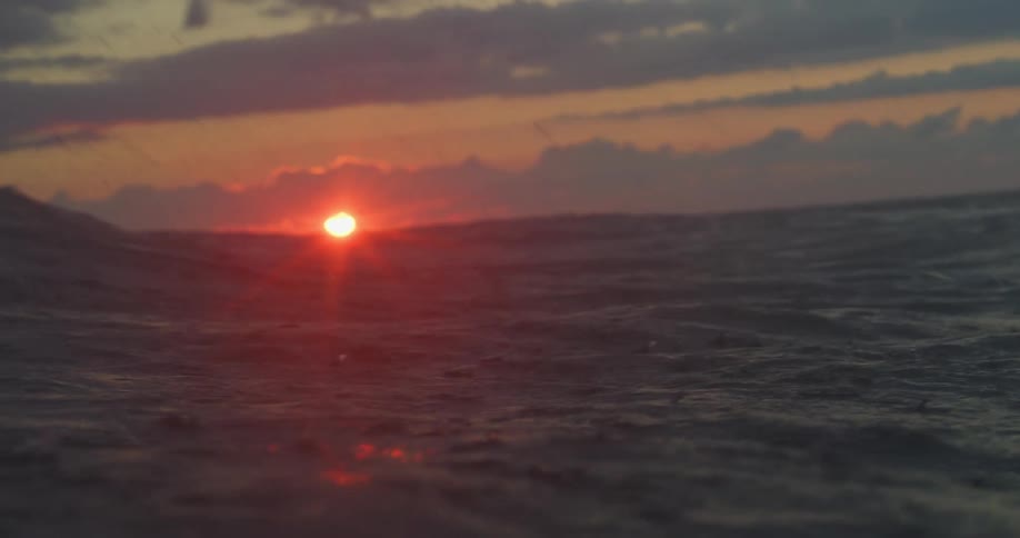 Choppy ocean waves at sunrise sunset