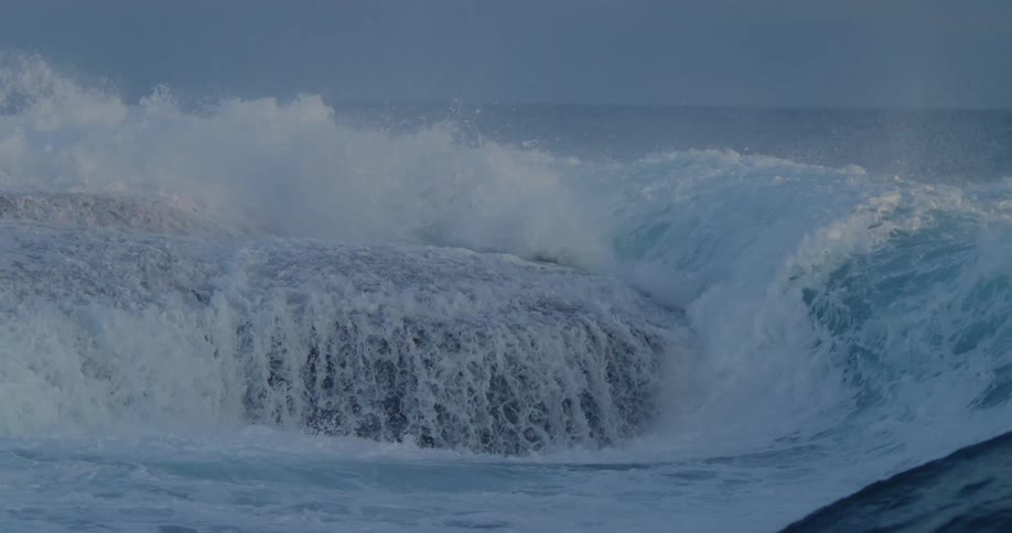 Sea with furious waves crashing on the rocky shoreline