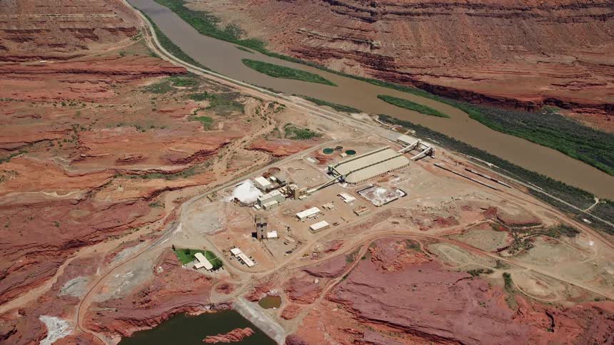An overhead shot of the Intrepid Potash manufacturing plant by the Colorado River in Moab Utah showcasing the industrial infrastructure amidst the arid desert landscape