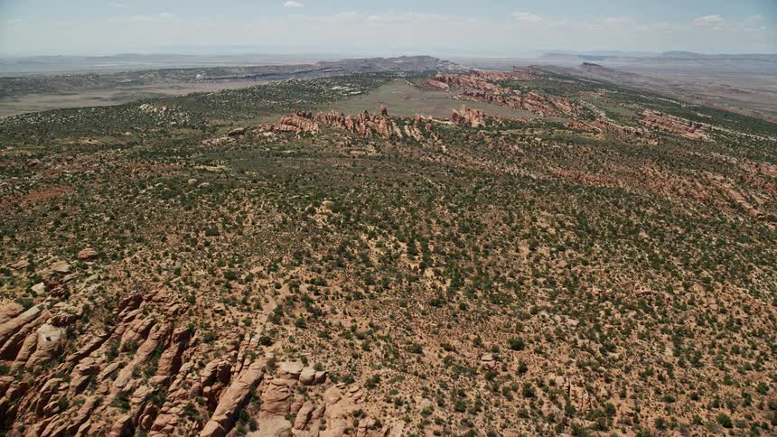 Approach the rocky landscape of Devil's Garden in Arches National Park Utah in this stunningaerial footage showcasing the famous desert landscape during a sunny day in summer