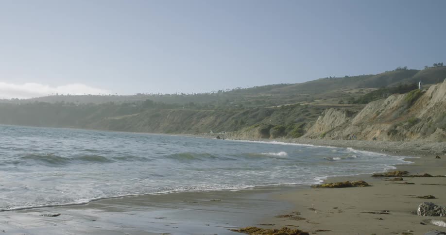 Waves crash against the beach